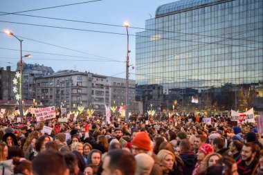 Serbian students and citizens protest against government corruption after Novi Sad railway station accident, in Slavija square in Belgrade, Serbia on 22 December 2024 clipart