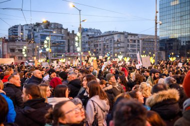 Serbian students and citizens protest against government corruption after Novi Sad railway station accident, in Slavija square in Belgrade, Serbia on 22 December 2024 clipart