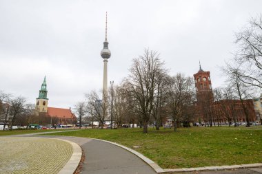 Rotes Rathaus, Berlin City Hall and Berliner Fernsehturm, Berlin TV tower, on Alexanderplatz in Berlin, Germany on 4 January 2025 clipart