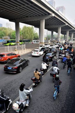 Morning rush hour traffic on 3rd Ring Road East (San Huan Lu), one of the main highways in Chaoyang district in downtown Beijing, capital of China on 22 April 2024 clipart