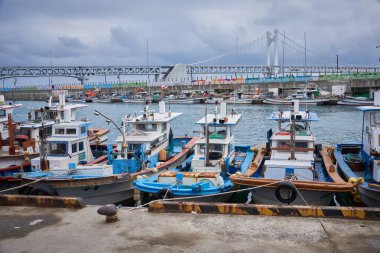 Fishing boats in the port of Busan, South Korea on 15 February 2023 clipart