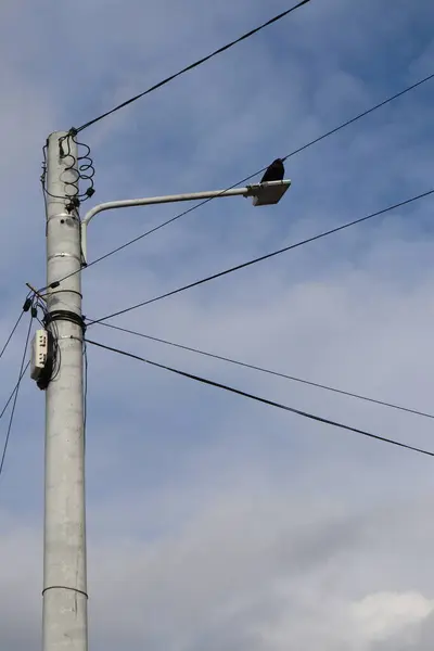 stock image high voltage power lines in the sky