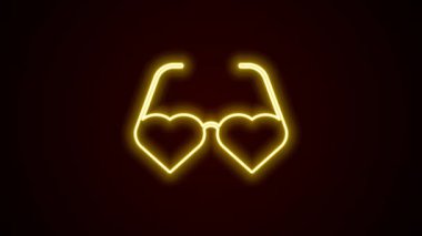 Parlayan neon çizgisinde kalp şeklinde aşk gözlüğü simgesi siyah arka planda izole edilmiş. Sevgililer Günü kartı tasarımı için uygun. 4K Video hareketli grafik canlandırması.