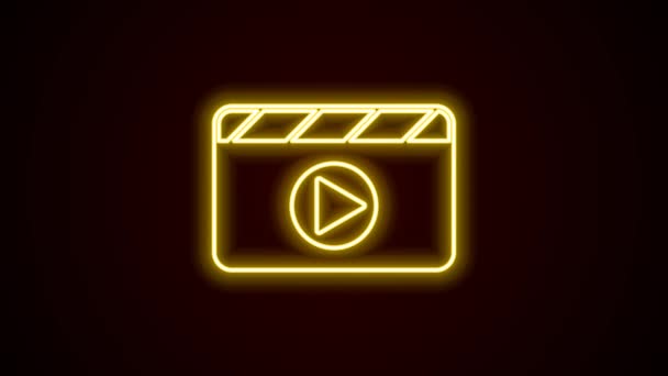 发光的霓虹灯线电影拍手图标隔离在黑色背景 电影拍板 板上的标志 电影制作或媒体行业 4K视频运动图形动画 — 图库视频影像
