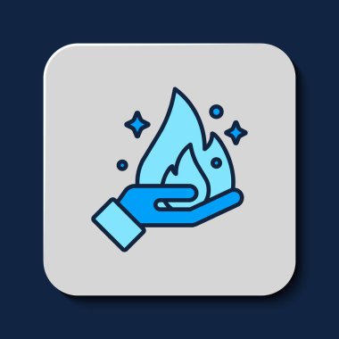 Filled outline Hand holding a fire icon isolated on blue background. Vector.