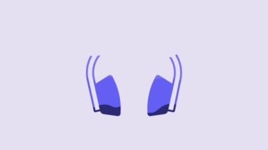 Blue Noise canceling headphones icon isolated on purple background. Headphones for ear protection from noise. 4K Video motion graphic animation.