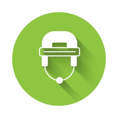White Hockey helmet icon isolated with long shadow background. Green circle button. Vector