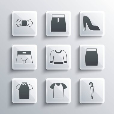 Set tişörtü, Şemsiye, Etek, Süveter, Polo, Erkek iç çamaşırı, papyon ve Kadın ayakkabı ikonu. Vektör