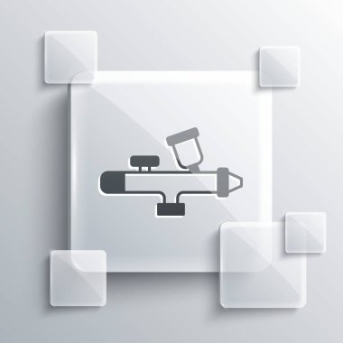 Gri arkaplanda gri boya tabancası ikonu var. Kare cam paneller. Vektör.