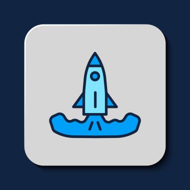 Filled outline Rocket icon isolated on blue background.  Vector