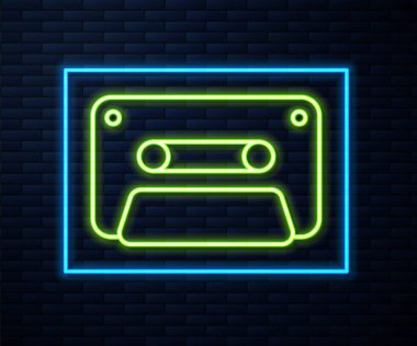 Glowing neon line Retro audio cassette tape icon isolated on brick wall background.  Vector