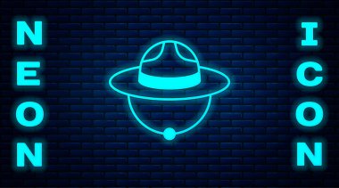 Glowing neon Canadian ranger hat uniform icon isolated on brick wall background.  Vector clipart