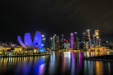The view of Art Science museum and the business district at night. Famous iconic landmarks in Singapore. Taken on October 8th 2022 clipart