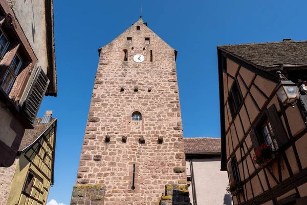 stock image Riquewihr historical town with half timbered houses along the narrow cobble stoned street. Taken in Riquewihr, France on June 11 2023