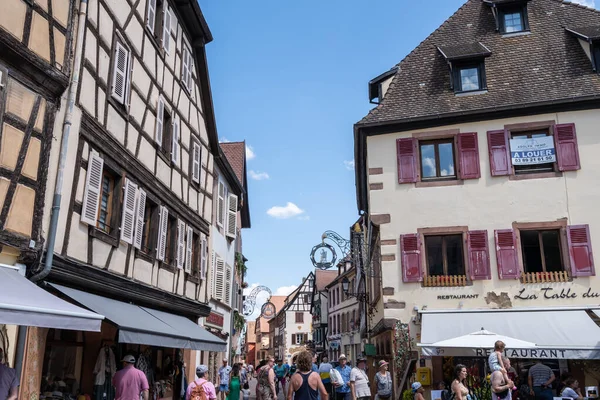 stock image Small colorful german half timbered houses in Kaysersberg along the main street. Taken in Kaysersberg, France. Taken on June 11 2023