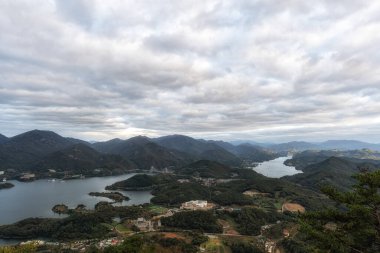 Cheongpyeong ho cable car lake view. Taken atop of Bibongsan mountain top during sunset hours. Famous tourst attraction in Jecheon, South Korea clipart