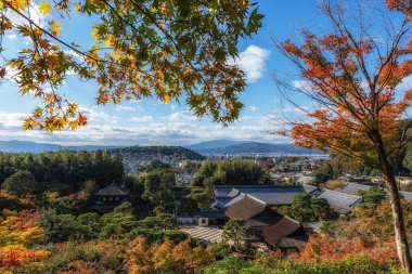 Ginkakuji Higashiyama Jishoji temple and Togudo with the view of Kyoto in the distance captured from the nearby observation deck during autumn foliage season. Famous landmark shinto temple in Kyoto, Japan clipart