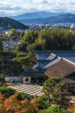 Ginkakuji Higashiyama Jishoji temple and Togudo with the view of Kyoto in the distance captured from the nearby observation deck during autumn foliage season. Famous landmark shinto temple in Kyoto, Japan Taken on November 19 2024 clipart