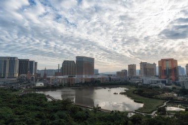 Cotai Strip and surrounding casinos and hotel viewed from across the ecological pond in Taipa, Macao. Taken on December 16 2024 clipart