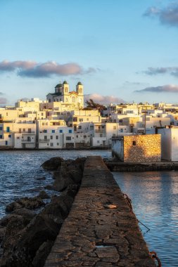 Sunset view over Naousa Marina in Paros taken during winter season. Famous iconic tourist village in Paros, Greece clipart