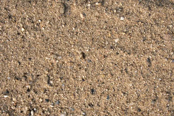 Kum zemin dokusu. Kum ve taşlar toprak zemin arkaplan dokusu