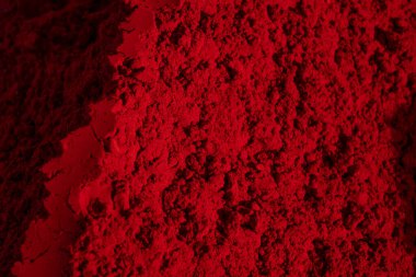 Close-up of organic deep red colored Sindoor or kumkum as background. Herbal gulal or Holi colors. Selective focus. High quality photo