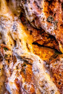 Beautiful background of natural stones in rose beige crystal colors close-up. Close-up of a rocky cliff. High quality photo