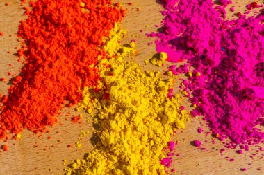 Bright colours for holi festival on the table, colourful Gulal. High quality photo