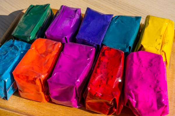 Dry colours Gulal packed in plastic pack placed at market shop for sale for Indian Festival Holi. High quality photo