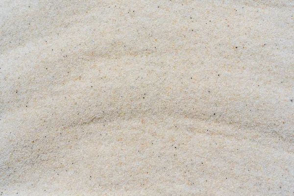 白い砂の背景 白い砂や抽象的な白い砂の波のテクスチャのマクロを閉じます 高品質の写真 — ストック写真