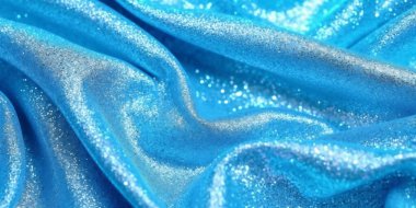 Mavi ipek parıltılı lüks kumaş arka plan, makro yakın çekim, kopyalama alanı. Dalga, desenli. 