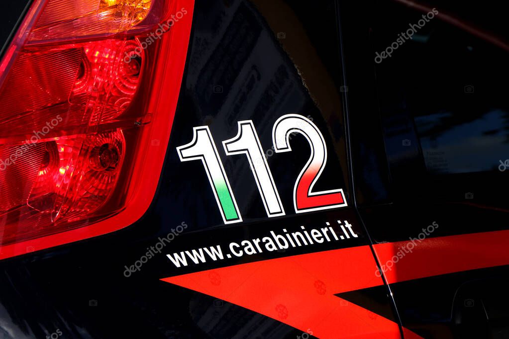 Side of an Italian Carabinieri car with emergency number 112 and website. Puglia, Italy. High quality photo
