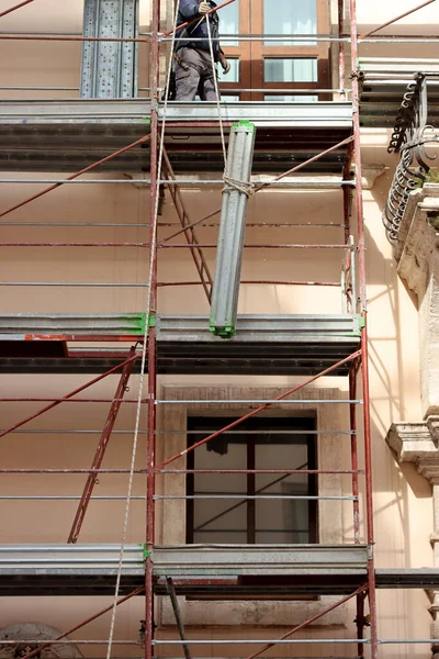 Scaffolding for building renovation work on a building facade. High quality photo