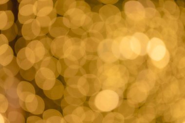 Farklı arkaplanlar için bulanık Altın Bokeh Şekilleri. Işık, Noel ve yeni yıl temalı özet altın bokeh.