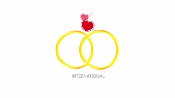 国際結婚機関の日の結婚式の婚約指輪とハート アートビデオイラスト — ストック動画