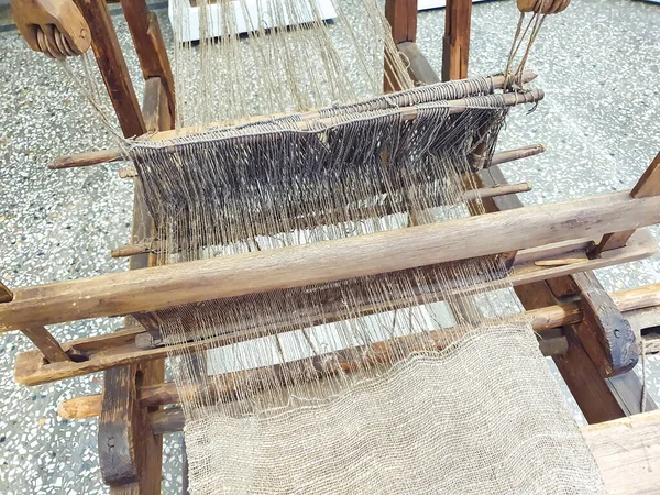 Old traditional hand weaving loom machine. Close-up