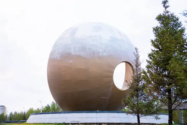 stock image bowl form with hole fountain in central capital park. back view. Astana Nur-Sultan, Kazakhstan - 10.24.22