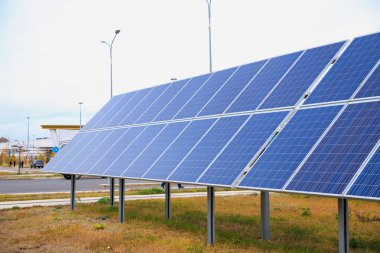 Ground mounted Solar power photovoltaic panels on grass. Solar power system. Close-up.