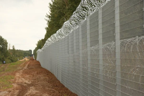 stock image Barbed wire steel wall against the immigrations in Europe