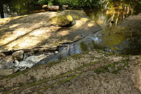 stock image The riverbed is in granite