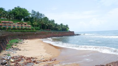 Goa,India, dated 13.06.2024. Beautiful view of crowd less or empty sinquerim beach in monsoon, Goa. clipart