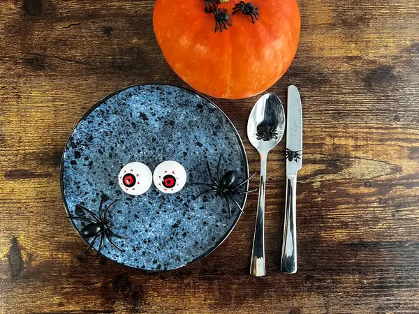 stock image Hauntingly creative table arrangement: Vertical top view of Halloween-themed setup featuring festive elements. High quality photo