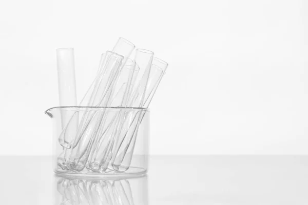 Transparent glass test tubes on a white background, laboratory, medical equipment, glass, chemistry, biochemistry, chemical laboratory, template, for medicine, for drug advertising, tests, medical