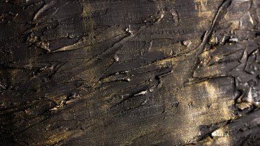 Microtexture black relief strokes with golden plating