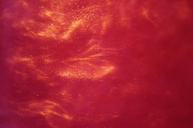 abstract red background with sparkles liquid waves and motion