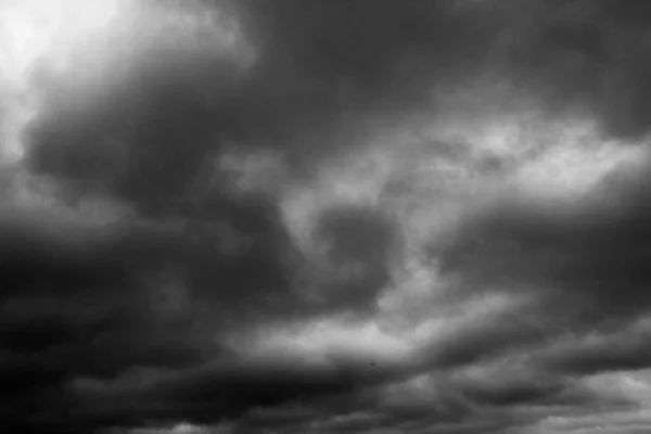 Black and white sky. Dramatic clouds. Horror. Background, banner. Horror, explosion, catastrophe, sadness, horror, melancholy.