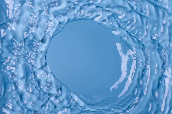 Water and waves in the form of a circle.Waves are circular. Water movement. Round hole in the water. Funnel. Water expansion. Water background.