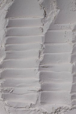 Un dokusu, toz, beyaz kum. - Beyaz. Şişkinlik, göçükler, çatlaklar, damga, krater.