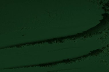 Küresel ısınma kavramı, tasarlamak için alanı olan siyah yeşil arka plan. Eski bir taş duvarın kabataslak yüzeyi. Yakın plan. Koyu yeşil zümrüt rengi. Geçmişi. Katı. Grunge. yeşil göz farı. Kraterler. yeşil toprak