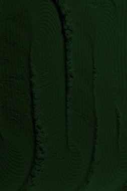 Küresel ısınma kavramı, tasarlamak için alanı olan siyah yeşil arka plan. Eski bir taş duvarın kabataslak yüzeyi. Yakın plan. Koyu yeşil zümrüt rengi. Geçmişi. Katı. Grunge. yeşil göz farı. Kraterler. yeşil toprak